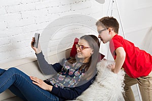 Kids in glasses with tablet, computer addiction