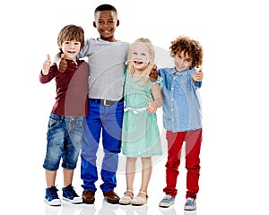 Kids, group and thumbs up for diversity in studio portrait with smile, hug or care by white background. Girl, boy or