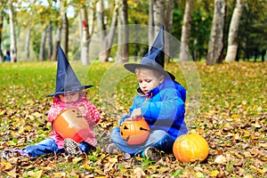 Kids in halloween costume play at autumn park