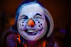 Kids Halloween scarecrow makeup face paint glowing in black light