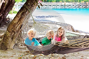 Kids in hammock. Children at tropical beach