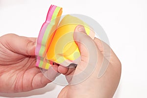 Kids hand holding colorful sticky stickers