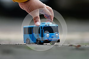 Kids hand palying car toys