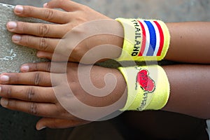 Kids' hand with Thailand wristband