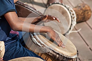 Kids hands on african drums in outdoor