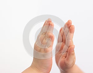 Kids hands high five on white background closed up