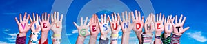 Kids Hands Holding Word Viel Gesundheit Means Stay Healthy, Blue Sky photo