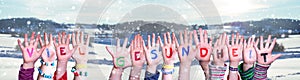 Kids Hands Holding Word Viel Gesundheit Means Stay Healthy, Snowy Winter Background photo