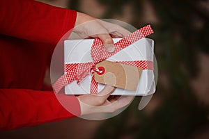 Kids Hands Holding Gift Christmas Box. Top view. Copy space for Text.