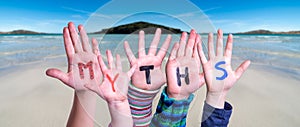 Kids Hands Holding Word Myths, Ocean Background