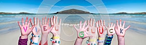 Kids Hands Holding Word Viel Glueck Means Good Luck, Ocean Background
