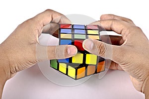 Kids hands solving rubiks cube