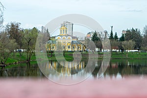 Kids having fun in ferris wheel with chains, carousel ski flyer in amusement park in Targoviste, Romania, 2020.