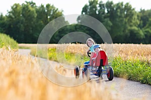 Kids having fun with a go cart car