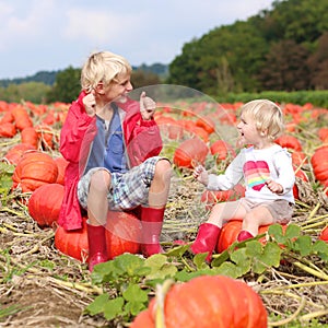 Kids having fun on pumpkin field