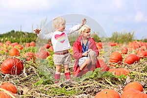 Kids having fun on pumpkin field