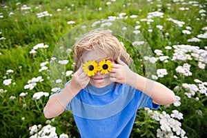 Kids having fun in spring park. Child on green grass.