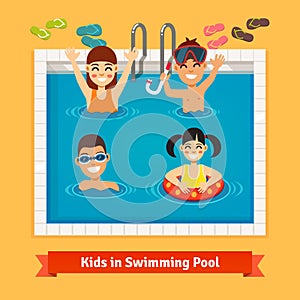 Kids having fun and swimming in the pool