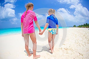 Kids having fun at tropical beach on caribbean vacation