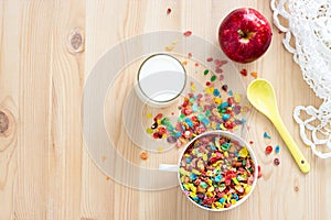 Kids healthy quick breakfast. Colorful rice cereal, milk and red