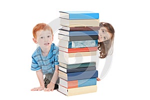 Kids hiding behind school books