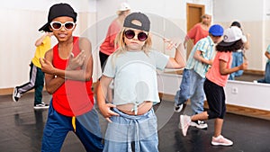 Kids hip hop dancers posing at studio