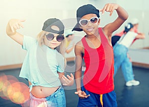 Kids hip hop dancers posing at studio