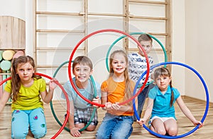 Kids holding hula hoops