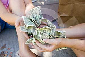 Kids holding money