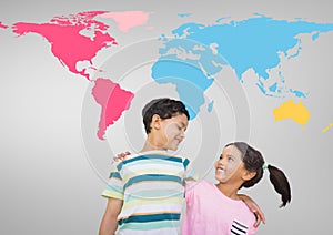 Kids hugging in front of colorful world map