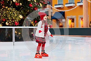 Kids ice skating in winter. Ice skates for child