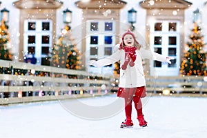 Kids ice skating in winter. Ice skates for child.