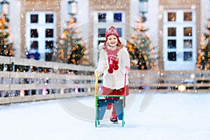 Kids ice skating in winter. Ice skates for child.