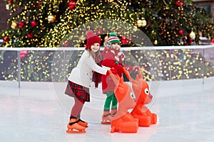Kids ice skating in winter. Ice skates for child