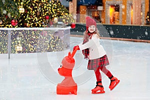 Kids ice skating in winter. Ice skates for child