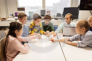 Kids with invention kit at robotics school