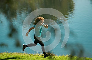 Kids jogging in park outdoor. Healthy sport activity for children. Little boy at athletics competition race. Young