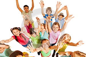 Kids jumping and lifting hands in the air