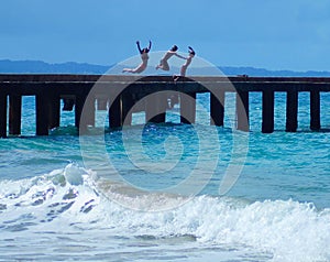 Kids Jumping off Pier Into Ocean in Puerto Rico