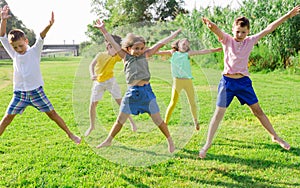 Kids jumping and raising hands