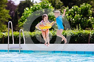 Kids jumping into swimming pool