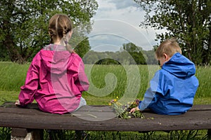 Kids with just picked hand-tied bouquet in the springtime