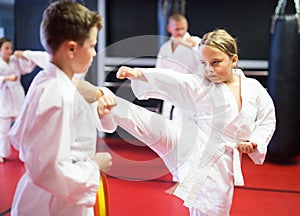 Kids on karate training in gym