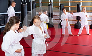 Kids on karate training in gym