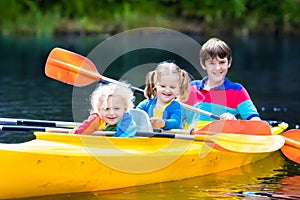 Kids kayaking on a river