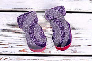 Kids knitted woolen room slippers.