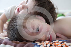 Kids laughing, happy children smiling portrait, playing together siblings, little girl and boy, brother and sister