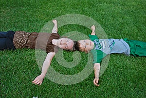 Kids laying on grass