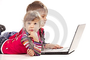 Kids laying with notebook