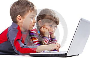 Kids laying with notebook
